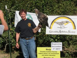 Judy Lincoln from Raptor Rehab shows off a Red-Tailed Hawk at Band With Nature 201