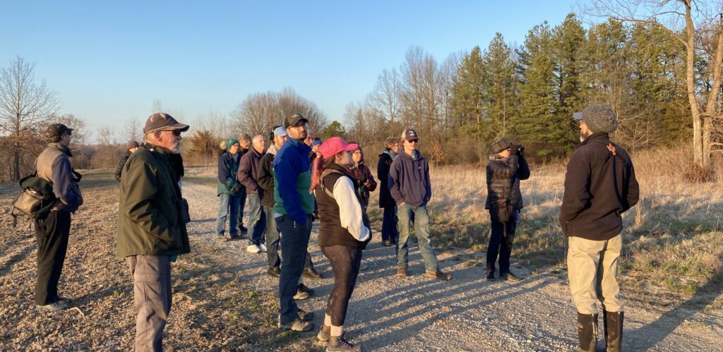 Participants gather before sunset to walk to the display grounds of the American Woodcock.